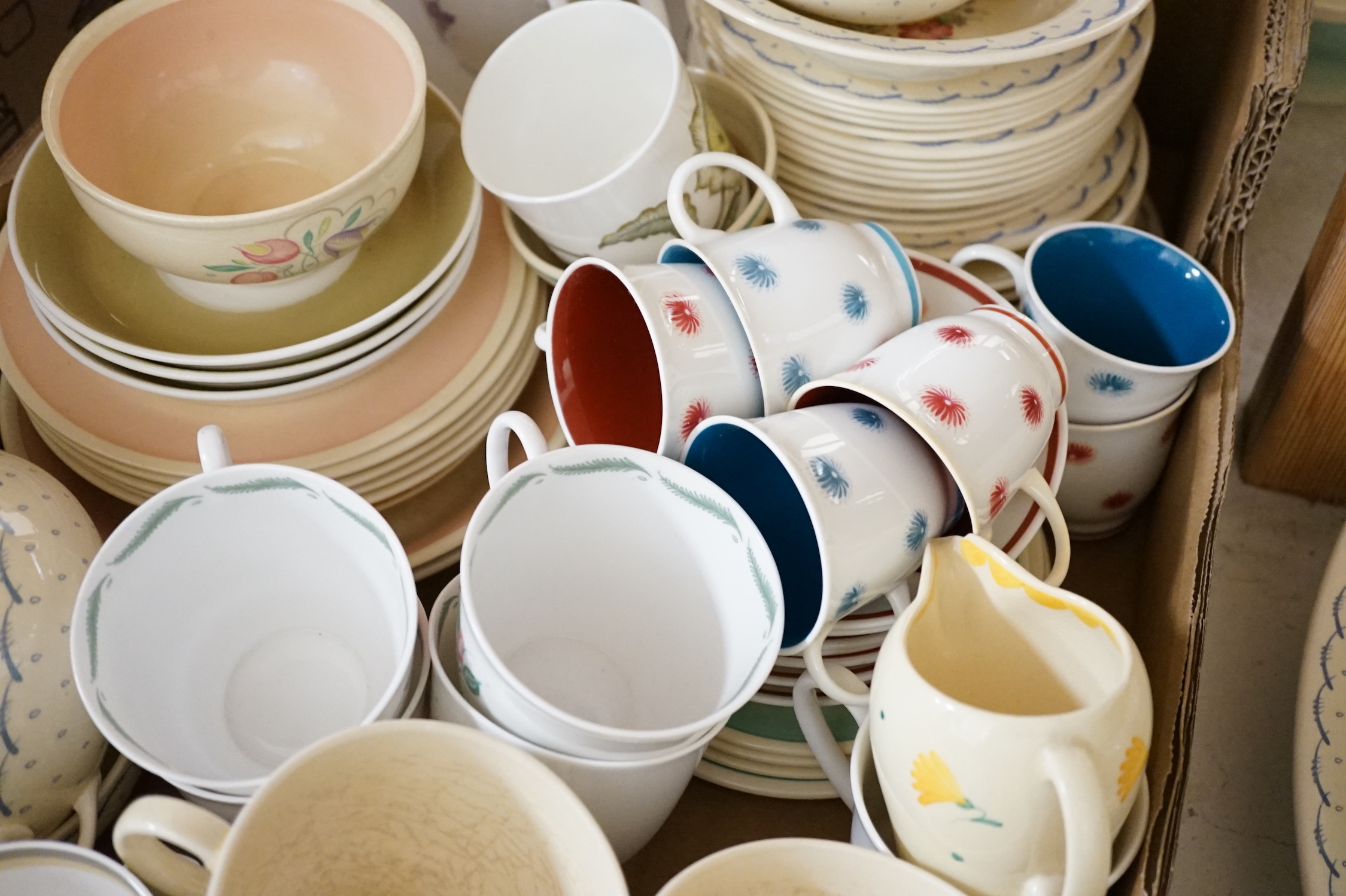 A collection of Susie Cooper ceramics and tablewares including tureens, an oval platter, cups and saucers